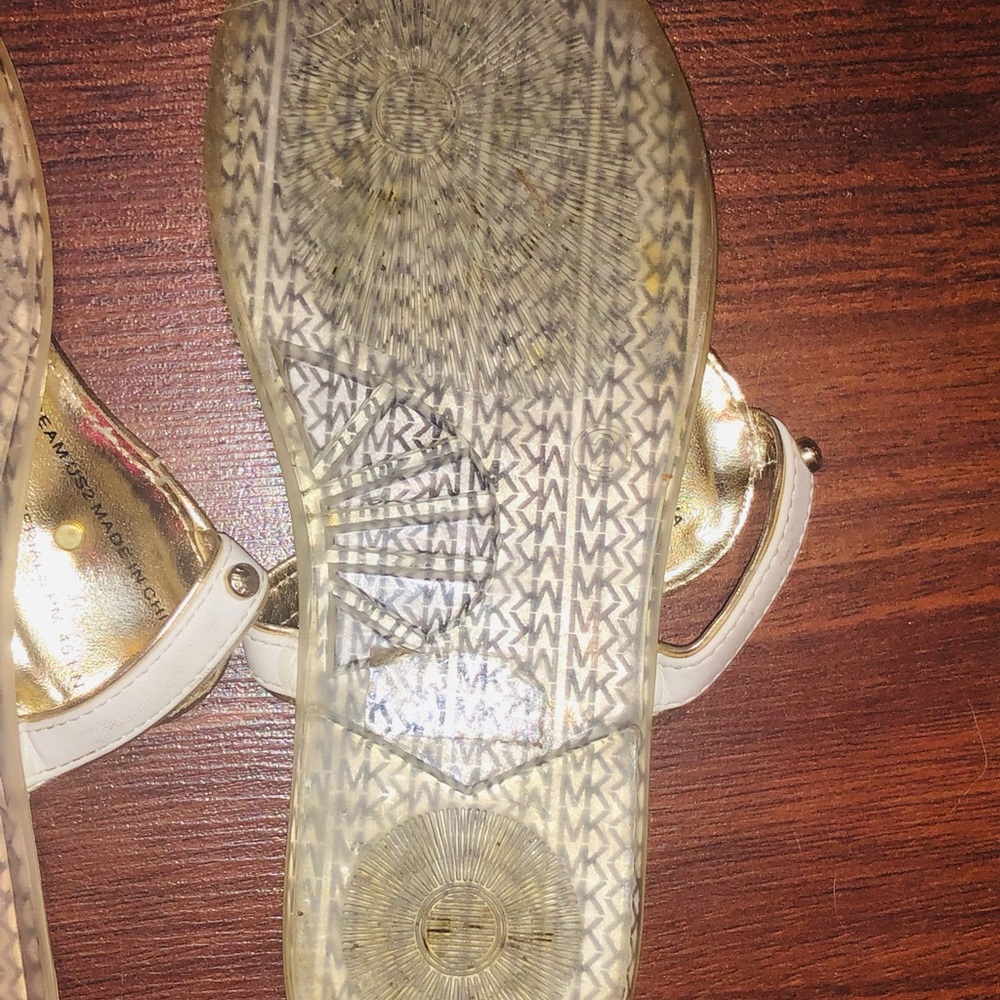 Micheal Kors Flip Flops. All white with a gold MK